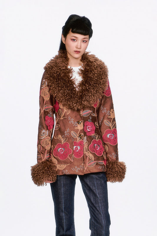 Embroidered jacket, blending romance and everyday wearability. Crafted in soft faux suede