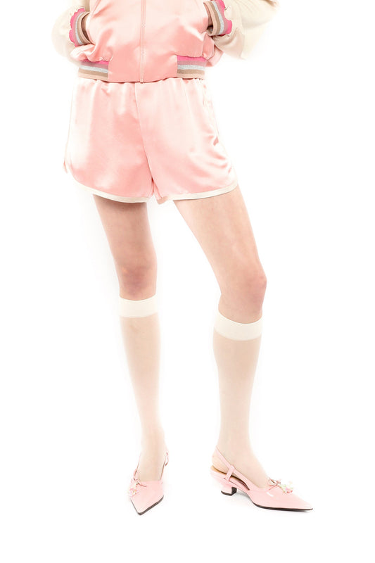 Pastel pink Satin Shorts with Satin Embroidered Souvenir Jacket, shown from the waist to the mid-thigh