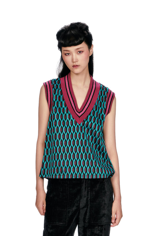 The bold fuchsia and pink striped trim at the V-neck and armhole add a playful, retro pop!