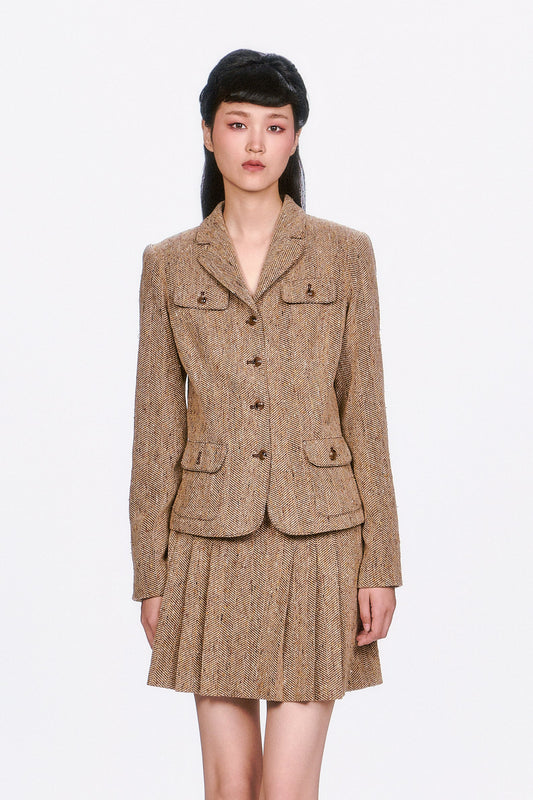 Structured and sophisticated, the Herringbone Jacket features a timeless pattern and a sharp, tailored fit. 