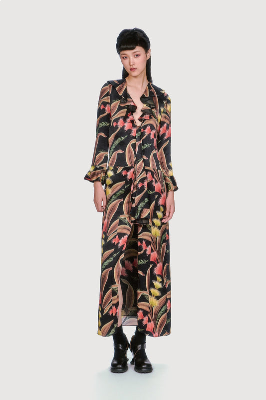 Feather-fern print and soft ruffles at the sleeves and neckline bring playful detail to this effortlessly