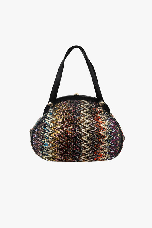 Bargello Memento Bag adds a pop of color and charm to any outfit, in a purse shaped-look. 